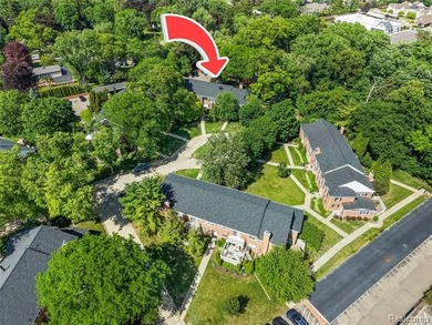 2-bedroom condo is nestled in a quiet neighborhood. The exterior - photo 5