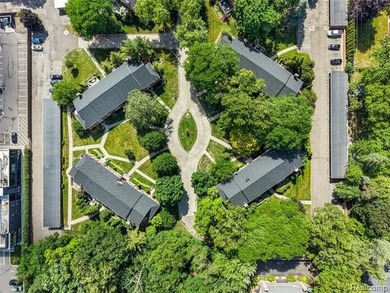 2-bedroom condo is nestled in a quiet neighborhood. The exterior - photo 6