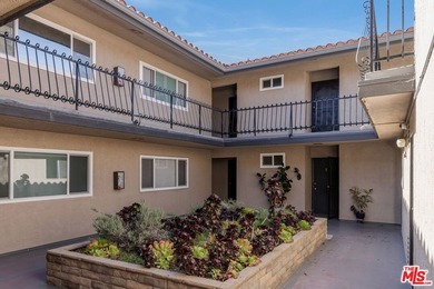 Welcome to this bright and inviting 2-bedroom, 1-bath end-unit - photo 3