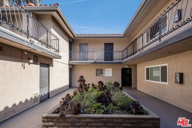 Welcome to this bright and inviting 2-bedroom, 1-bath end-unit - photo 4