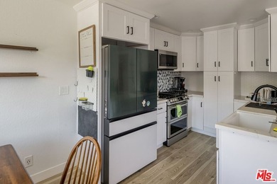 Welcome to this bright and inviting 2-bedroom, 1-bath end-unit - photo 9