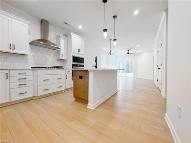 This home pairs soft sage-green and elegant frost gray cabinetry - photo 1