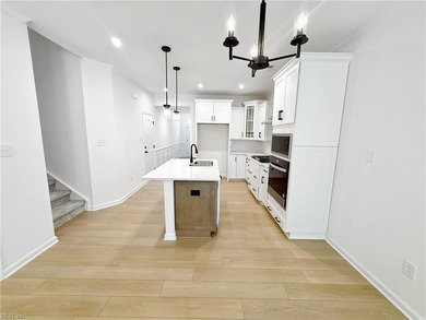 This home pairs soft sage-green and elegant frost gray cabinetry - photo 4