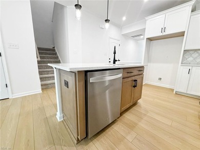 This home pairs soft sage-green and elegant frost gray cabinetry - photo 5