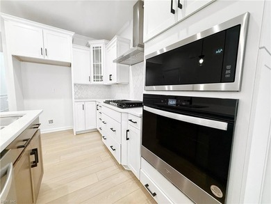 This home pairs soft sage-green and elegant frost gray cabinetry - photo 6