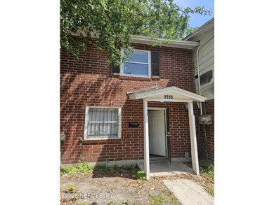 Move-in-ready 3-bedroom, 1.5-bath townhouse featuring a new roof - photo 1