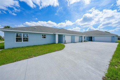 This nearly completed WATERFRONT TRIPLEX in Rotonda West, FL, is