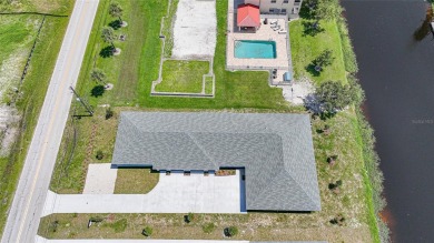 This nearly completed WATERFRONT TRIPLEX in Rotonda West, FL, is