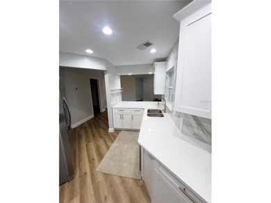 Fully remodeled, this stunning 3-bedroom, 2-bath single-family - photo 11