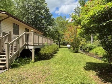 Welcome to your Creekfront Oasis, located in the sought-after