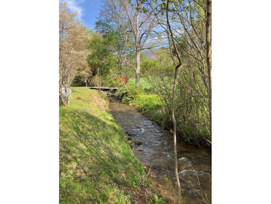 Welcome to your Creekfront Oasis, located in the sought-after