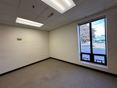 This large office offers 14 private offices, enclosed reception - photo 16