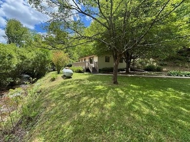 Welcome to your Creekfront Oasis, located in the sought-after