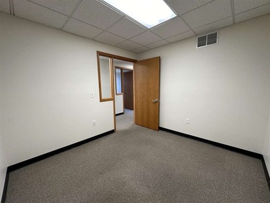This large office offers 14 private offices, enclosed reception - photo 19