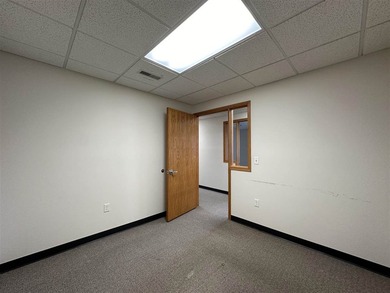 This large office offers 14 private offices, enclosed reception - photo 21