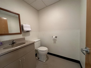This large office offers 14 private offices, enclosed reception - photo 26