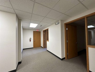 This large office offers 14 private offices, enclosed reception - photo 27