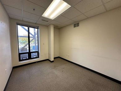 This large office offers 14 private offices, enclosed reception - photo 30