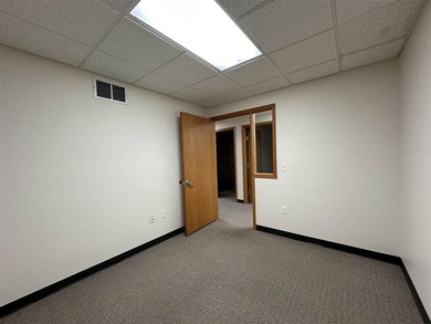 This large office offers 14 private offices, enclosed reception - photo 31