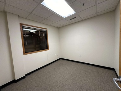 This large office offers 14 private offices, enclosed reception - photo 33