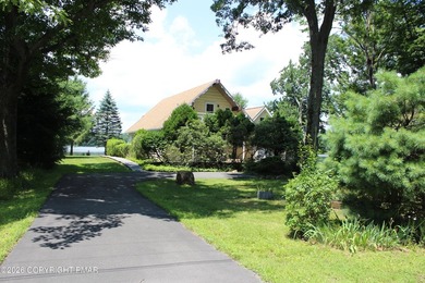 This LAKE FRONT property is truly one of a kind and features - photo 1