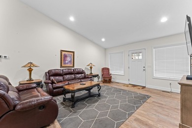 In town convenience with the comfort of main level living awaits