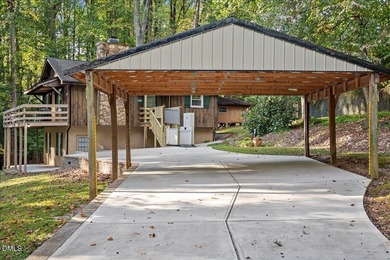 Set on a stunning, private one-acre lot, this three-bedroom