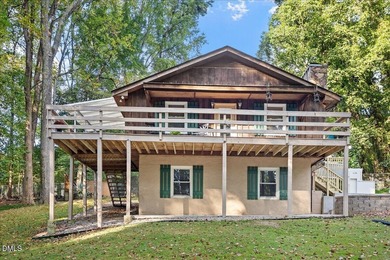 Set on a stunning, private one-acre lot, this three-bedroom