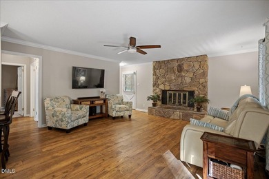 Set on a stunning, private one-acre lot, this three-bedroom