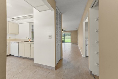 Welcome to this charming two-bedroom, two-bathroom condominium - photo 3