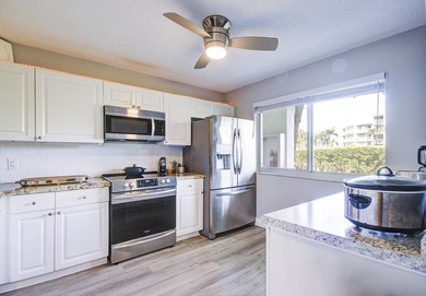 YOU WILL WANT THIS 1ST FLOOR... END UNIT ...WITH IMPACT GLASS - photo 3