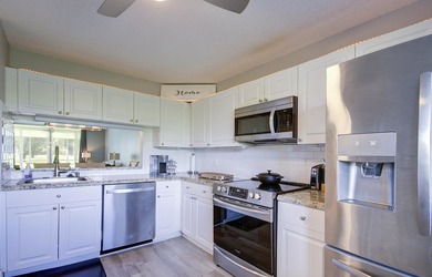 YOU WILL WANT THIS 1ST FLOOR... END UNIT ...WITH IMPACT GLASS - photo 4