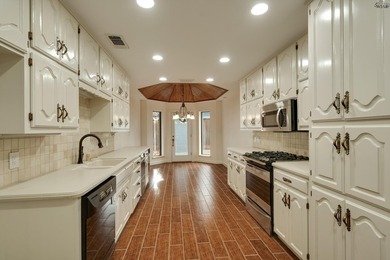 Tucked on a corner lot in Midwestern Park, this 4-bed, 3-bath - photo 14