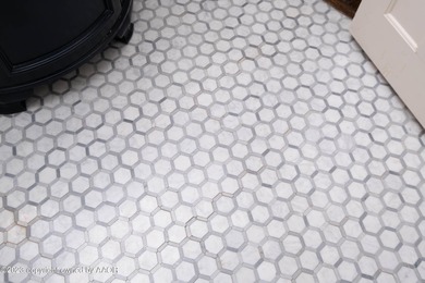 Refined living under the big elms on the brick streets. This