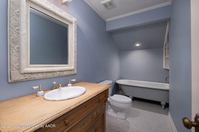 Refined living under the big elms on the brick streets. This