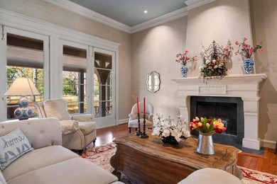 Nestled far back from the street on a peaceful 7.44-acre lot