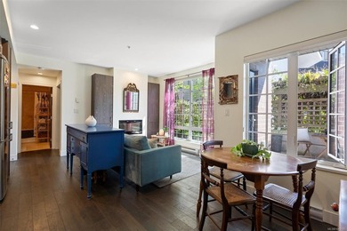Just minutes from Cook Street Village, this bright ground-level - photo 1
