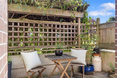 Just minutes from Cook Street Village, this bright ground-level - photo 10