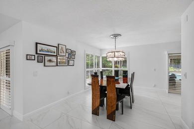 Located within the prestigious Eastpointe Country Club with - photo 7