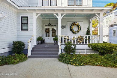 A showcase of refined coastal craftsmanship, this custom-built