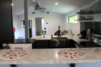 This home is priced to sell. Fully furnished. Open concept - photo 17