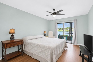 FIRST FLOOR UNIT - PRIME LAKEFRONT VIEWS. Wake up to serene - photo 3