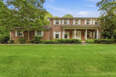 Experience timeless elegance and lakeside serenity at 99 Hilltop - photo 1