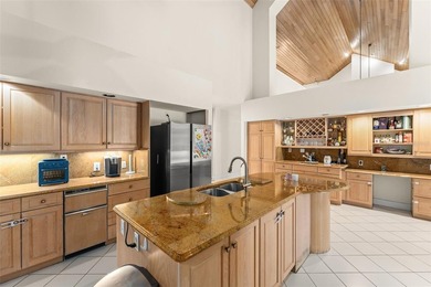 Set on an elevated corner homesite within Isleworth, this - photo 14