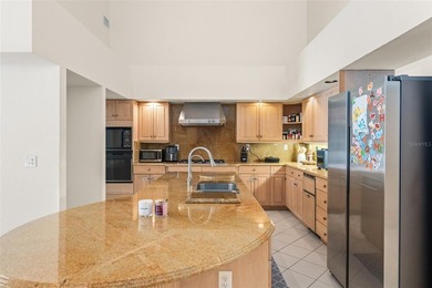 Set on an elevated corner homesite within Isleworth, this - photo 15