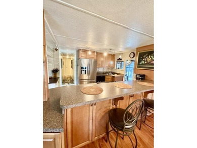 Welcome to this charming three-bedroom, two-bathroom mobile home - photo 3