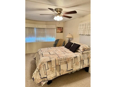 Welcome to this charming three-bedroom, two-bathroom mobile home - photo 8