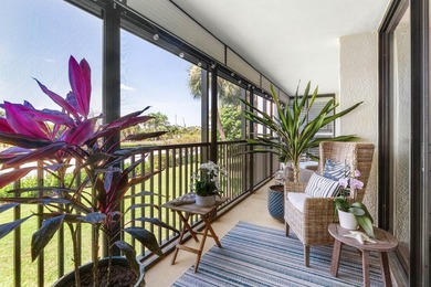 Positioned mere steps from the shoreline, this three-bedroom - photo 1