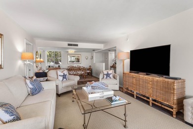 Positioned mere steps from the shoreline, this three-bedroom - photo 4