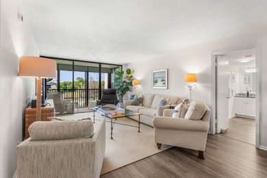 Positioned mere steps from the shoreline, this three-bedroom - photo 5